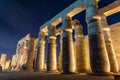 Luxor temple colonnade illuminated at night, Luxor, Egypt