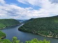 luxuriant landscape of a lake surrounded by thick forest incredible aerial view in Romania Transylvania