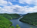 luxuriant landscape of a lake surrounded by virgin forest incredible aerial view in Romania Transylvania