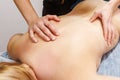 Luxuriate in a blissful back massage experience with a trained masseur in a serene spa ambiance.