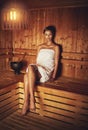 Luxuriating in the steam. Full length portrait of a young woman relaxing in the sauna at a spa. Royalty Free Stock Photo