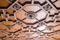 Luxurious antique wooden ceiling decorations in an old minor. Expensive geometric shapes made of hard wood