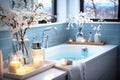 Luxurious bathroom filled with water with blue tiles on the walls, flowers and candles Royalty Free Stock Photo