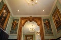 Luxurious Bathroom with Gold Mirrors and Sconces