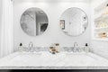 A luxurious bathroom with two circular mirrors. Royalty Free Stock Photo