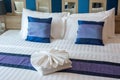 Luxurious bedroom with towels design on the bed Royalty Free Stock Photo