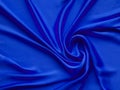 smooth elegant luxurious electric blue satin background texture close up - abstracted wallpaper