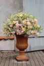 Luxurious bouquet of roses, lilies and gypsophila in a classic large vase
