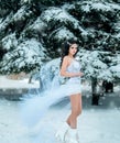 Luxurious brunette in a white dress