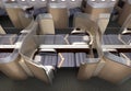 Luxurious business class cabin interior. Each seat divided by frosted acrylic partition