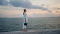 Luxurious businesswoman looking sea view standing on embankment calm evening. Royalty Free Stock Photo