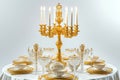 A luxurious candlelit dinner setting in a baroque style, an ornate golden candelabra holding white taper candles at its center.