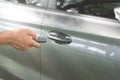 A luxurious car owner using a key remote control to lock, unlock and start car engine, a photo of selective focus with concept of Royalty Free Stock Photo