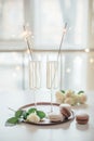 Luxurious champagne wedding party with white roses and macaron d