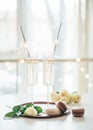 Luxurious champagne wedding party with white roses and macaron d