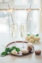 Luxurious champagne wedding party with white roses and macaron d