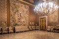 Luxurious chandelier and decorated room inside palace in Naples