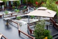 Luxurious Chinese garden restaurant seats and ancient building turret Royalty Free Stock Photo