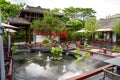 Luxurious Chinese garden restaurant seats and ancient building turret Royalty Free Stock Photo
