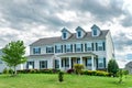 luxurious country house with a large green lawn in the front yard Royalty Free Stock Photo