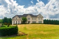 luxurious country house with a large green lawn in the front yard Royalty Free Stock Photo