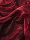 Luxurious deep red satin silk fabric, elegantly draped with soft, smooth textures and rich folds. Royalty Free Stock Photo