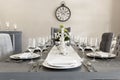 A luxurious dining room of a house with glasses and plates