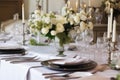 Set table for a party or wedding reception. Luxurious elegant table setting with white dishes and flowers Royalty Free Stock Photo