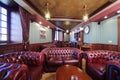 Luxurious english cigar room with leather armchairs