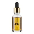 Luxurious 437 face oil in elegant glass bottle with gold dropper Royalty Free Stock Photo