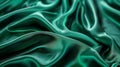 Luxurious folds of rich, emerald-green satin create a mesmerizing display of light and shadow, exuding a sense of