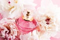 Luxurious fragrance bottle as chic perfume product on background of peony flowers, parfum ad and beauty branding