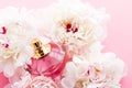 Luxurious fragrance bottle as chic perfume product on background of peony flowers, parfum ad and beauty branding