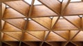 Luxurious geometric wooden triangles in construction. The concept of modern architecture, design and interior. Wood background.