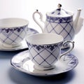 Luxurious Geometry: Intricate Patterns On Teacup, Saucer, And Teapot