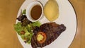 Luxurious glorious sirloin steak dinner with premium sides a feast for the senses along with potatoes, sauces and condiments good