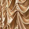 Luxurious gold satin fabric with a ruched pattern, creating an elegant, draped effect. Royalty Free Stock Photo