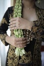 Golden black traditional Javanese Wedding Costume with Jasmine Flower