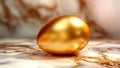 luxurious golden easter egg on marble surface Royalty Free Stock Photo