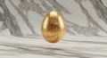 Luxurious Golden Egg on Marble Surface Royalty Free Stock Photo