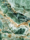 The luxurious green marble, infused with gold sediment lines, evokes a natural elegance. The contrast of the vivid green