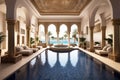 luxurious indoor swimming pool in Moroccan Arab style equipped with columns and exclusive furniture in a luxury villa Royalty Free Stock Photo