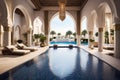 luxurious indoor swimming pool in Moroccan Arab style equipped with columns and exclusive furniture in a luxury villa Royalty Free Stock Photo