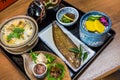 Luxurious Japanese meal set - broiled sole fish and boiled loaches with egg and burdock. Royalty Free Stock Photo