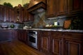 Luxurious kitchen with hard wood flooring