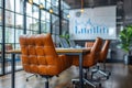 Open space with luxurious leather office chairs around a sleek table