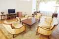 Luxurious living room with armchairs, sofa, wooden table