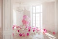 Luxurious living room with large window to the floor. Palace is filled with pink balloons Royalty Free Stock Photo