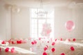 Luxurious living room with large window to the floor. Palace is filled with pink balloons Royalty Free Stock Photo
