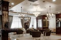 Luxurious lobby of modern hotel. Interior interior with sofas and chandeliers. Classic room design Royalty Free Stock Photo